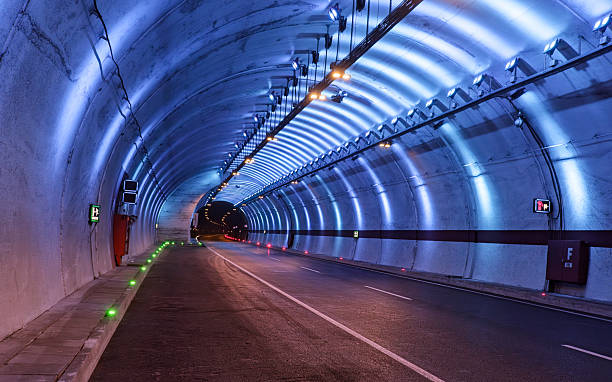 istock Illuminated modern road tunnel at night. 2225625641