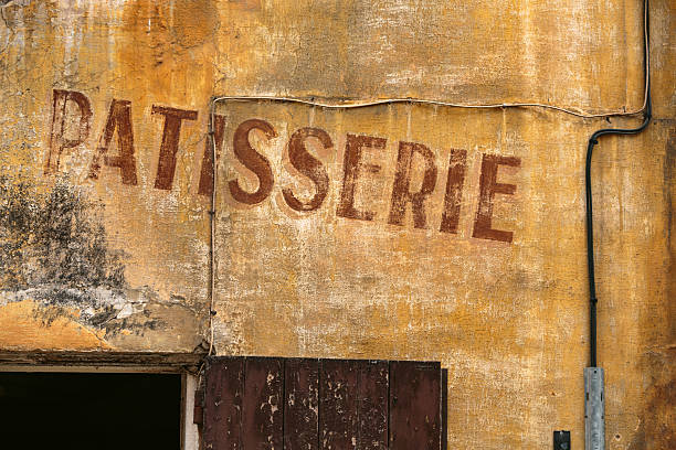 Old 'Patisserie' (bakery) sign painted on an old wall in Aix-en-Provence, France