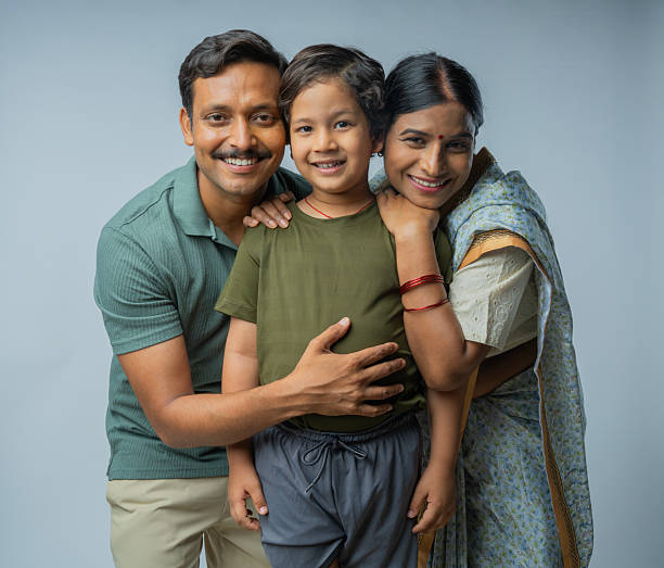 istock Loving parents with cute son standing on white background 2225630410