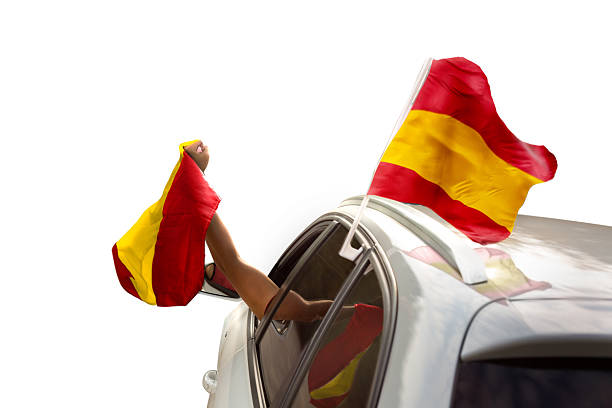 istock Fan with Spanish flag celebrating in a car isolated on white 2225632072