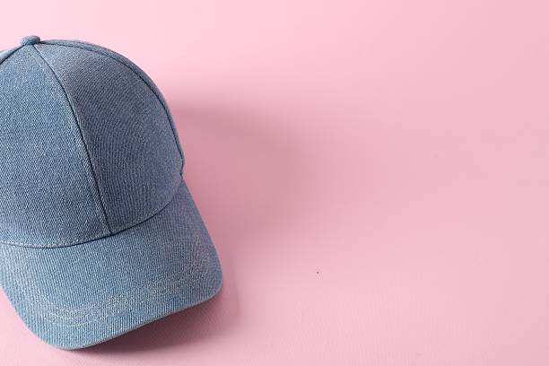 istock Stylish denim baseball cap on pink background. Mockup for design 2225632565