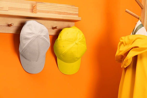 istock Stylish baseball caps indoors. Mockup for design 2225632687