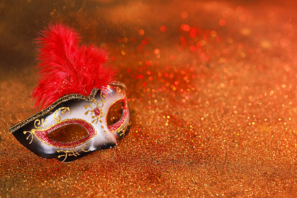 istock Beautiful carnival mask on shiny color background, closeup. Space for text 2225633138