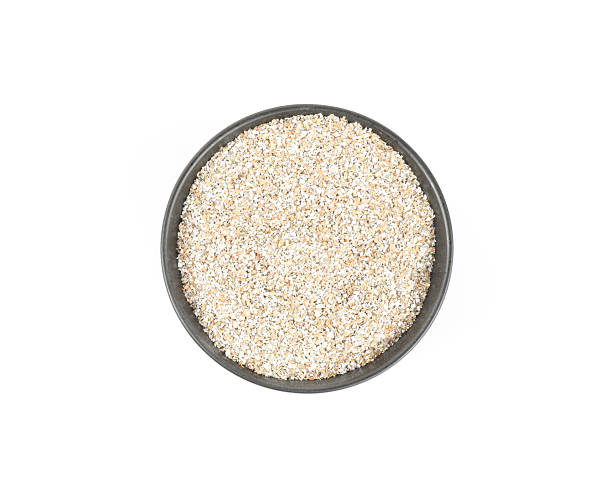 istock Rye bran in bowl isolated on white, top view 2225633683
