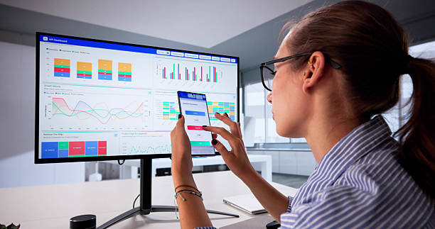 istock Young Female Data Analyst Examining Market Performance 2225634497