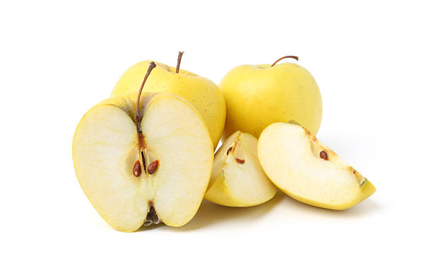 istock Whole and cut ripe yellow apples isolated on white 2225634873