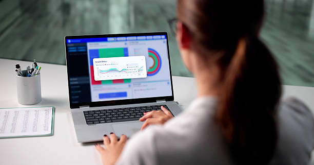 istock Analyzing Market Trends: Businesswoman Evaluates Data 2225635773