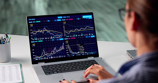 istock Young Female Broker Analyzes Stock Market Data 2225635814