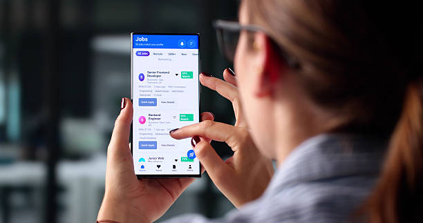 istock Woman Using Smartphone To Browse Job Opportunities 2225635857