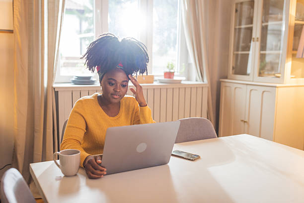istock Young Afro-american woman working on her laptop 2225637939