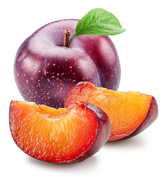 Ripe chinese plums with green leaf isolated on white background. File contains clipping paths.