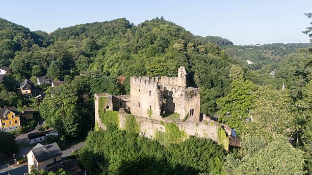 istock Castle ruin Balduinstein surrounded by lush summer greenery, drone view in the Lahn Valley 2225643187