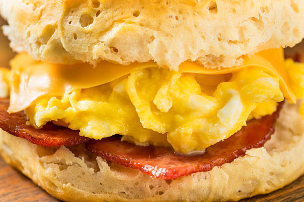 Greasy Bacon Egg and Cheese Buttermilk Biscuit Sandwich for Breakfast