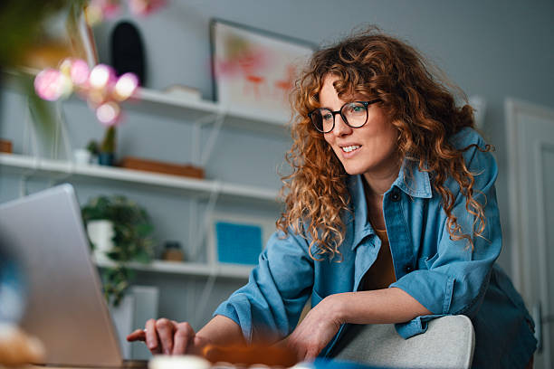 istock Confident Woman Working on a Laptop in a Cozy Home Office Setting 2225649068