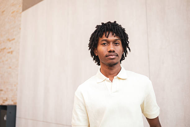 istock Young man with dreadlocks posing in the city 2225649881