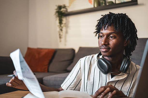 istock Focused young man studying and working from home office 2225650372