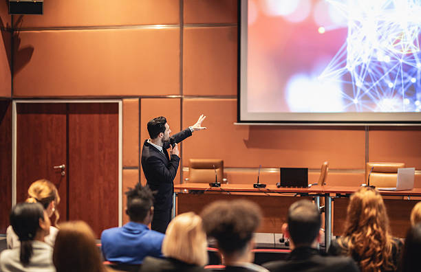 istock Caucasian Businessman Delivering Presentation at Professional Conference 2225652611