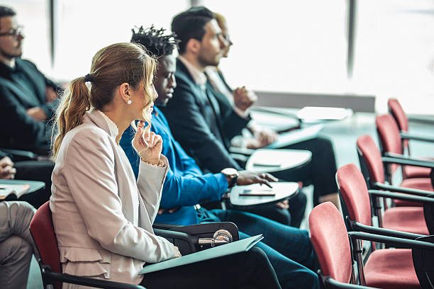 istock Diverse Business Professionals Engaged in a Conference Presentation 2225652656