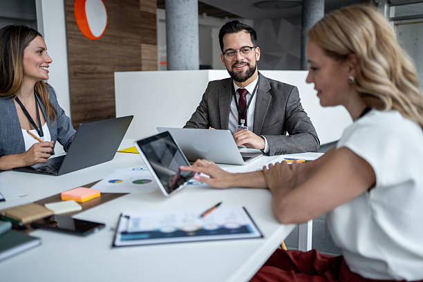 istock Business team analyzing data on tablet during meeting in office 2225652739