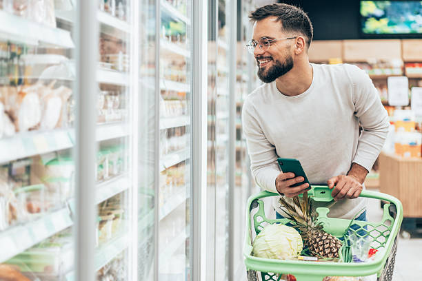 istock Handsome man shopping in supermarket 2225661713