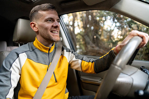 istock Mid adult man driving on a forest road 2225665048