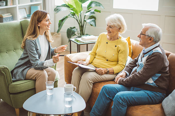 istock Senior couple consulting with insurance agent 2225665547