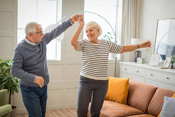 istock Senior couple at home dancing 2225665591