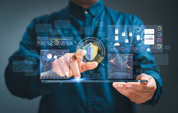 istock Concept Data Protection Cyber security. Businessman's hand Lock and shield icon work on virtual screen and dashboard for data business analysis data graphs,display at a modern workspace. 2225670846