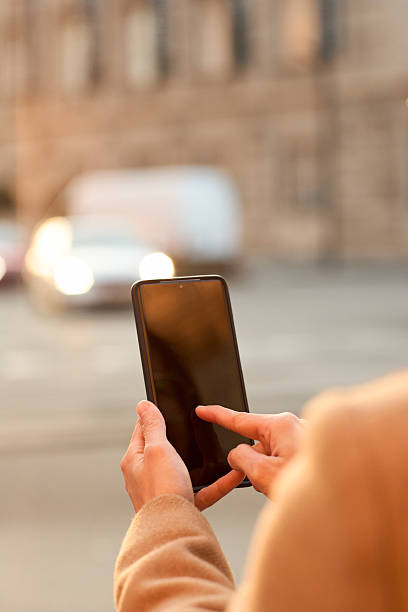 istock Woman Using Mobile Phone in Urban Street 2225676042