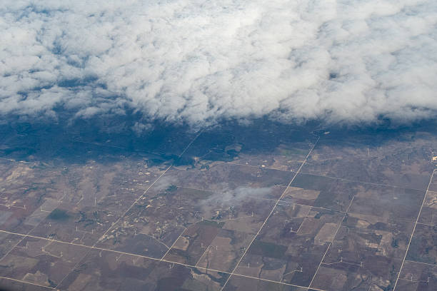 istock Aerial view of a landscape featuring windmill farms and patchwork agricultural fields 2225677565