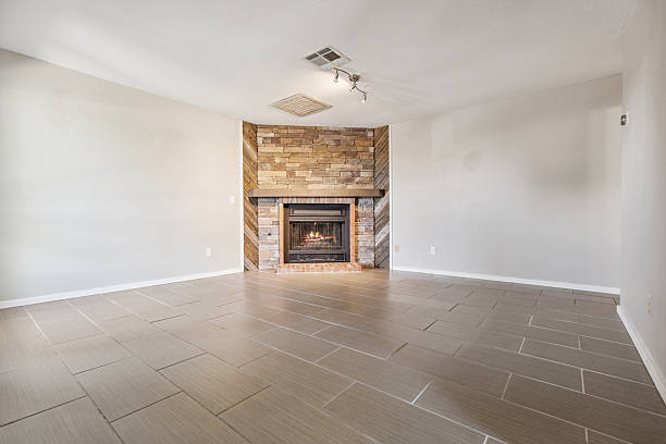 istock A vacant living room featuring a cozy fireplace situated in the corner 2225681889