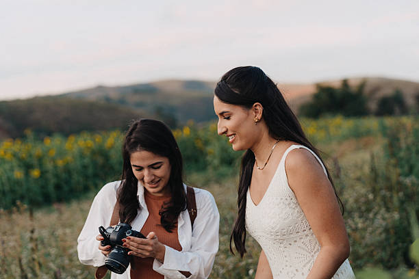 istock Two women reviewing camera screen outdoors 2225683398