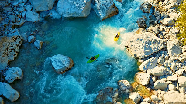 istock Kayaker conquers rapids, navigating through rocky river rapids in a thrilling adventure 2225690478