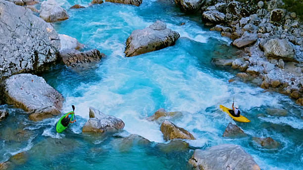 istock Kayakers navigate rapids, conquering the wild river's mighty waves 2225690481