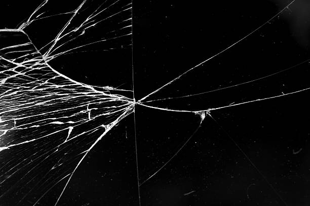istock cracked glass isolated in black background 2225690592