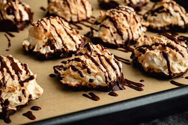 istock Macaroons Drizzled with Dark Chocolate on a Sheet Pan Close-up 2225703485