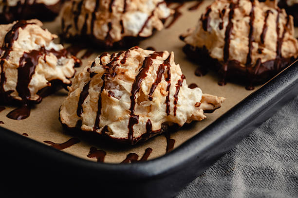 istock Macaroons Drizzled with Dark Chocolate on a Sheet Pan Close-up 2225704023
