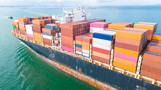 istock Side Cargo Container ship the ocean ship carrying container and running for import export concept technology freight shipping by ship. Container Vessel running out from international customs. 2225705655