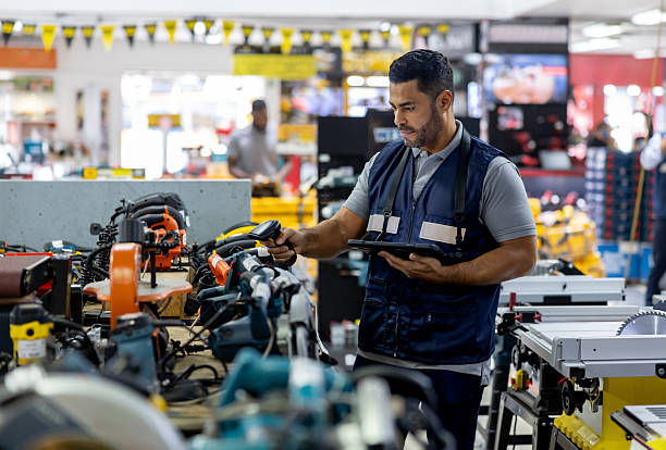 istock Retail clerk taking inventory of tools at a hardware store 2225706165