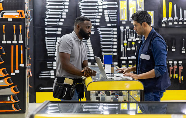 istock Customer talking to a retail clerk while shopping at a hardware store 2225709506