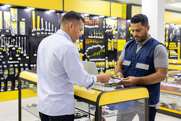 istock Man making a contactless payment while shopping at a hardware store 2225709515
