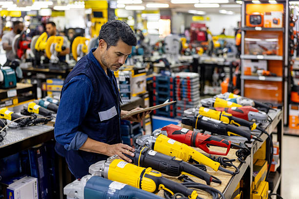 istock Man working at a hardware store taking inventory of the tools 2225709547
