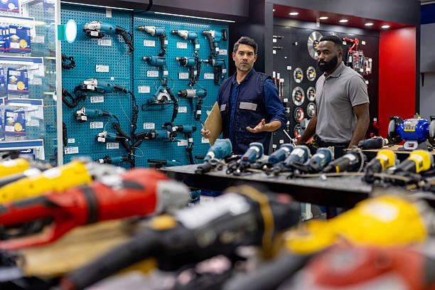 istock Business manager training a new employee selling tools at a hardware store 2225709559