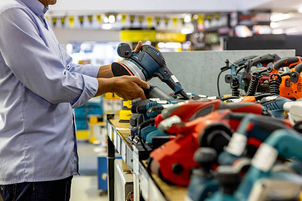 Close-up on a customer looking at tools at a hardware store - small business concepts