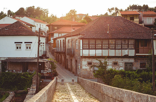 istock Cobblestone bridge leading into Ucanha, Tarouca, Portugal at sunset 2225709836