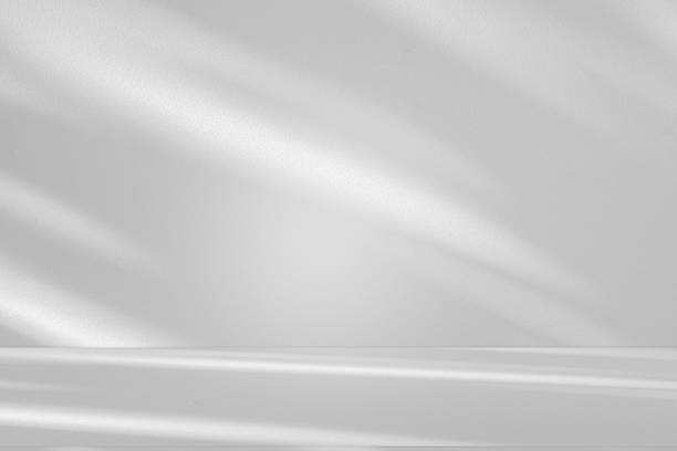 istock Wall interior background, studio and backdrops show products.with shadow from window color white . background for text insertion and presentation product 2225716584