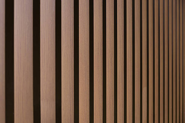 istock Close-up of a temporary wall with stripe-style partitions made of solid wood. Realistic texture. 2225717189