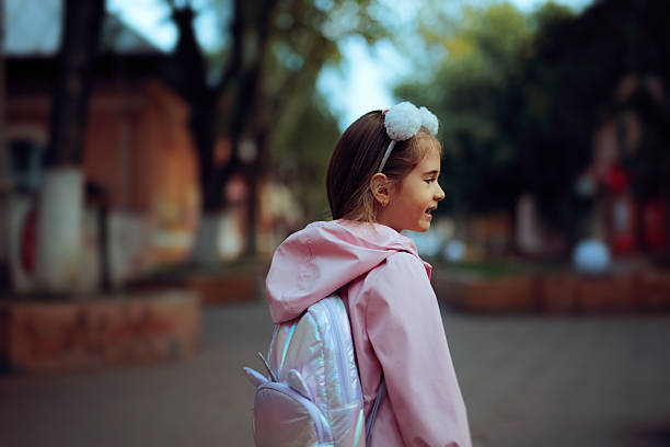 istock Happy Little Girl with Unicorn Backpack Going to School 2225719155