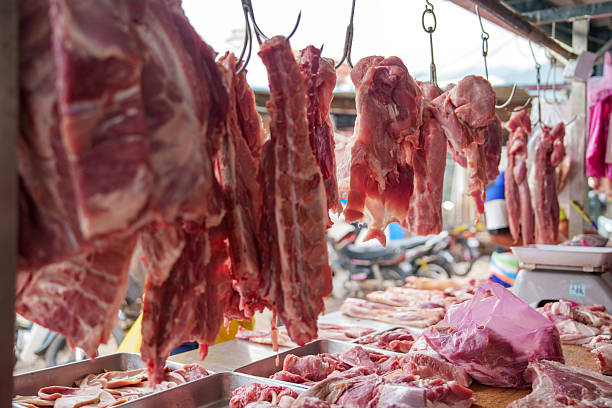 istock Fresh pork ribs and meat on display at butcher stall 2225720522