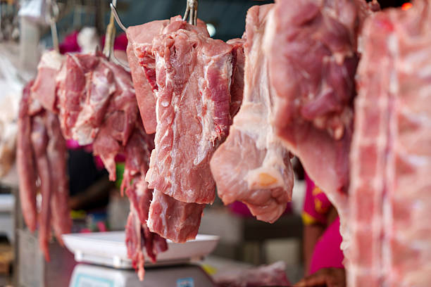 istock Fresh pork ribs and meat on display at butcher stall 2225720822